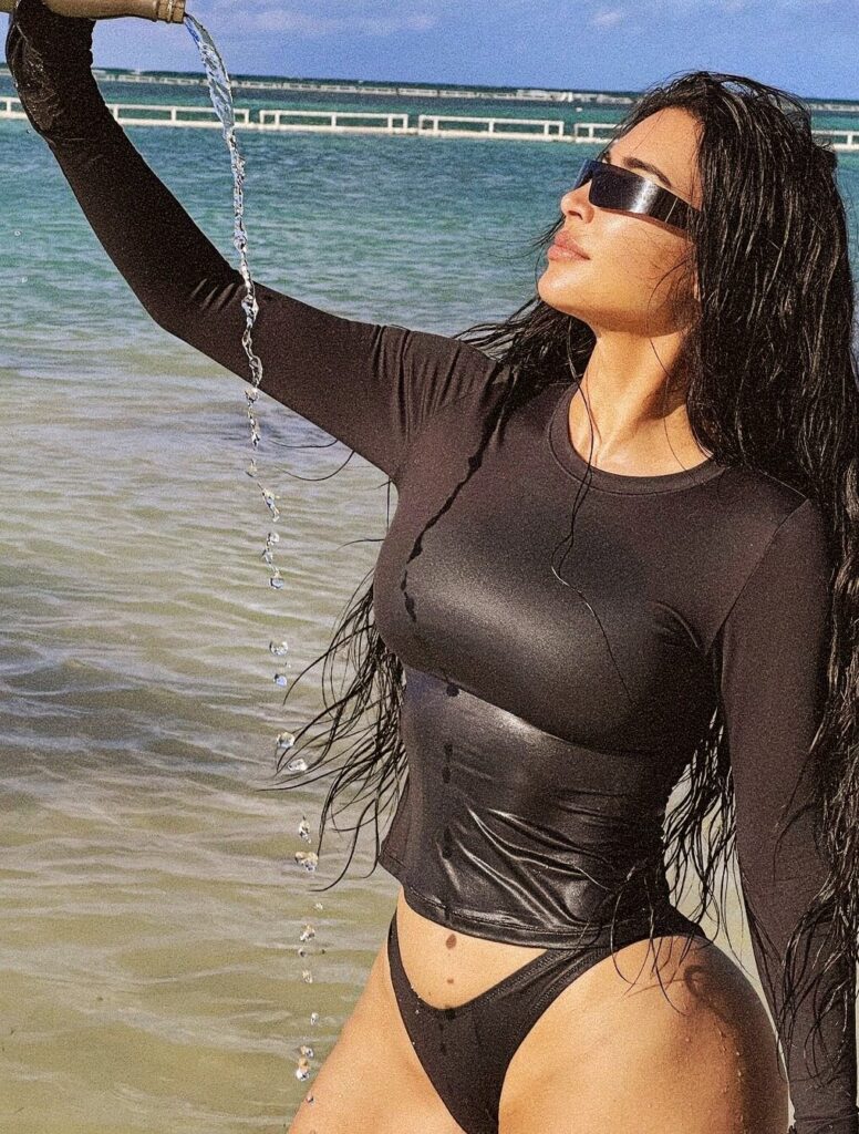 kim kardashian hot in black bikini pouring water