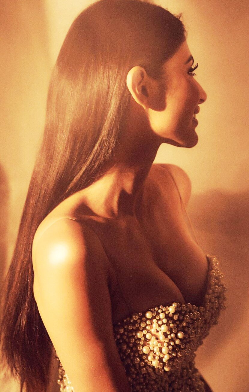 mouni roy naked boobs in a deep cut pearl dress
