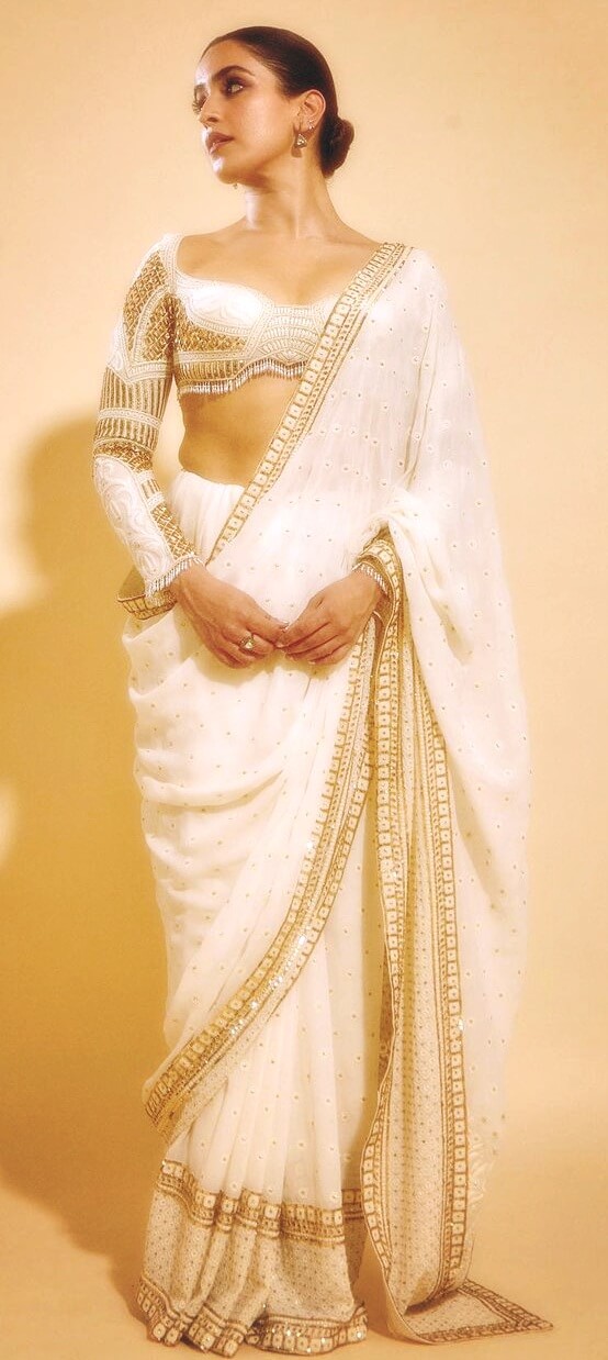 actress sanya malhotra in a white designer blouse and white and gold saree designed by falguni shane peacock
